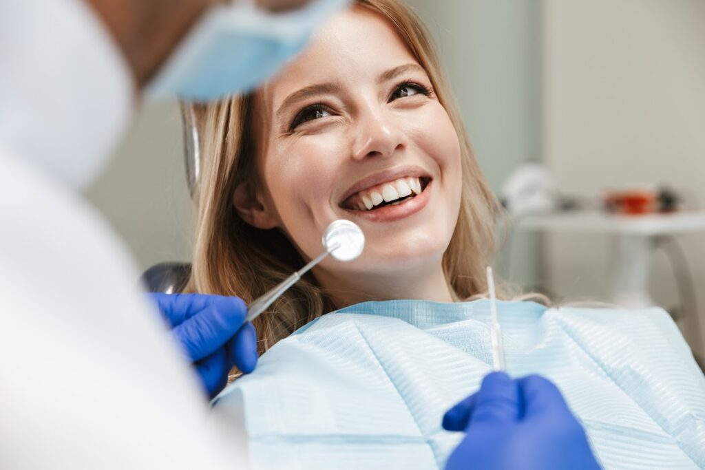 Dentist examining a woman 